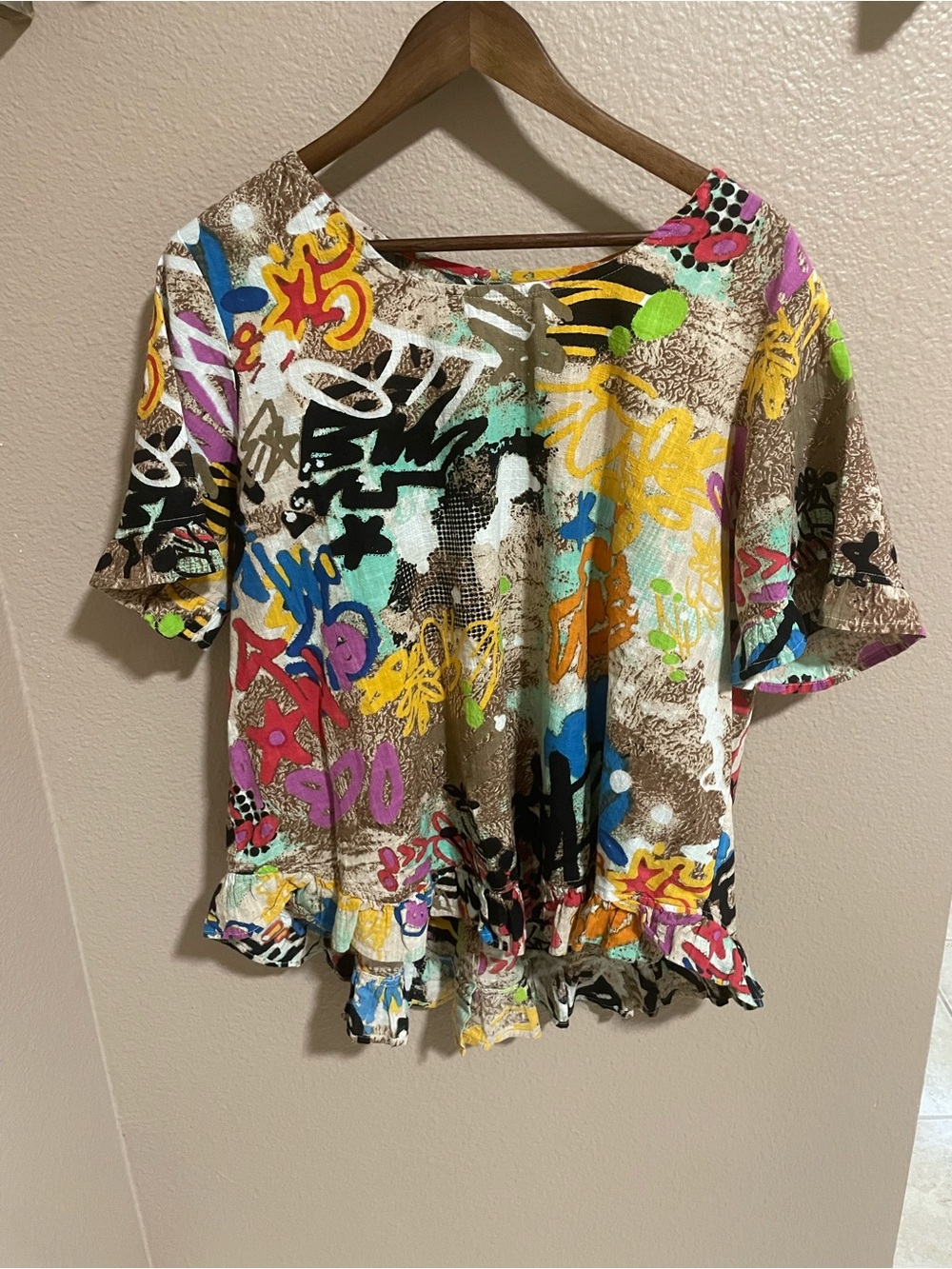 Orientique Multicolor Graffiti Short Sleeve Ruffle-Hem Top